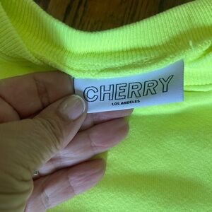 Cherry sweatshirt size large never worn acid yellow
